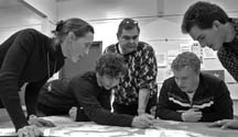Mapping the community: Instructor Zora Soprovich, Daniel Adaszynski, Alex Hugenschmidt, Matt Wate and Matt Emig poreover their collaborative mapping project, which was unveiled to the community at VIU grad in June.